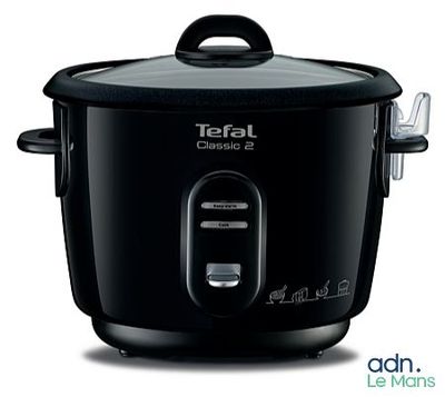 black electric rice cooker with lid open on a white background
