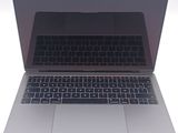 a close up of a laptop on a white surface