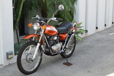 a motorcycle that is parked in front of a building