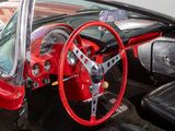 a red and black car with a red steering wheel