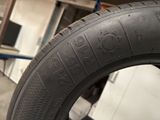 a tire with writing on it in a garage