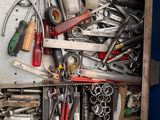 a metal box with many tools in it
