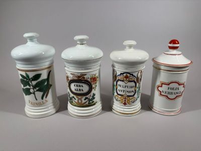 four different types of canisters are lined up on a gray surface
