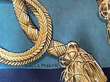 a picture of a woven rope with a tassel on it