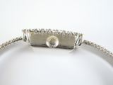 silver bracelet with a diamond clasp on a white background
