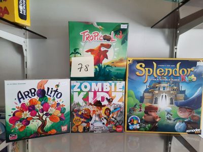 a lot of board games sitting on a table