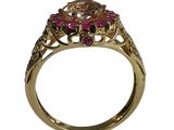 an image of a gold ring with pink and green stones on it