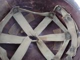 a close up of a helmet with a strap on it