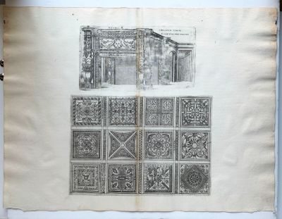 un vieux livre sur lequel figure le dessin d'un bâtiment