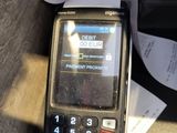 a cell phone sitting on top of a table next to a receipt