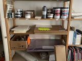a shelving with many items on it in a room