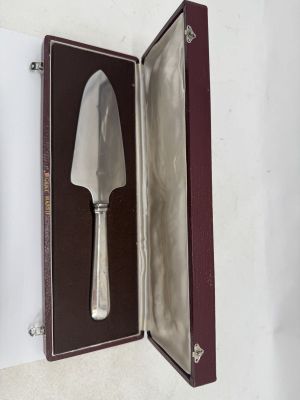 a knife in a case that is open on the table