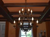 a chandelier that is hanging from the ceiling in the room