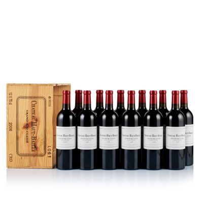 six bottles of red wine in a wooden box