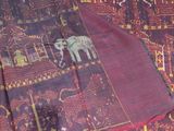 an image of a blanket with a picture of a elephant on it