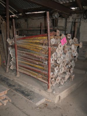 a pile of wood in the middle of a building