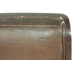 a close up of a brown suitcase on a white background