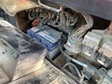 a car engine with a lot of wires and wires attached to it