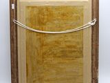 an image of a picture of a wooden frame with a rope