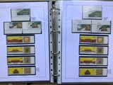 a binder with stamps on it and a picture of a train