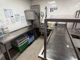 an image of a commercial kitchen with stainless steel counter tops