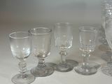 a lot of wine glasses sitting on a table
