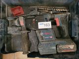 a box with tools in it on a tile floor