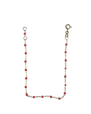 collier composé de perles rouges et d'une chaîne en or