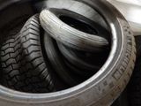 a lot of tires that are stacked together in a pile
