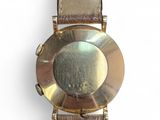 an image of a close up of a wrist watch on a white surface