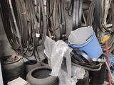 many different types of hoses on the shelves