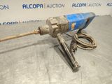 a close up of a drill with a cord attached to it