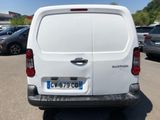 a white van that is parked in a parking lot