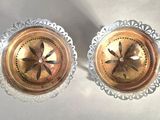 two small glass dishes on a white surface
