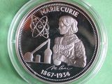 a close up of a coin in a plastic container on a green surface