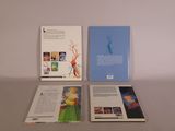 three books that are sitting on a table