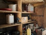 a man standing in a room with a lot of tools