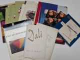 a lot of books that are sitting on top of a table