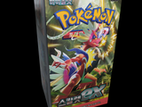 a box of pokemon trading cards on a black background