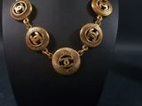 a close up of a necklace on a mannequin mannequin