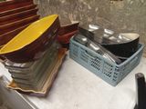many plates and bowls stacked on a table