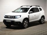 une photo d'une dacia blanche garée dans un garage