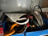 a blue box filled with assorted items on a table