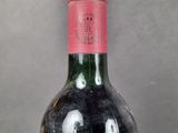 a bottle of wine that is sitting on a table