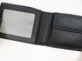 someone is holding a black wallet with a magnifying glass in it