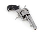 an old revolver with a black handle on a white background