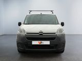 the white van is parked in a room with a black floor