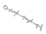 a close up of a silver bracelet with a cross on it