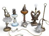 many different types of lamps that are on the table