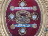 a gold frame with a picture of a dragon on it